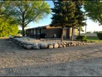 After: new fieldstone retaining wall with landscape rock beds