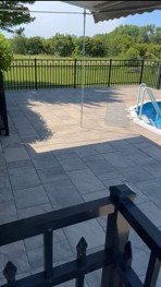 After: releveled patio with new gravel and sand around the pool